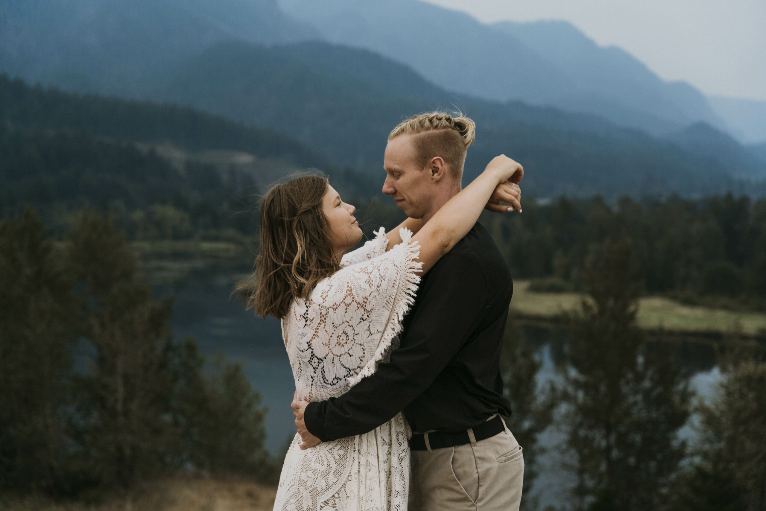 A couple stands together in the columbia river gorge after exchanging vows during their elopement.