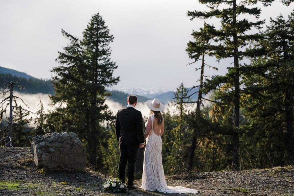 couple stands in front of mt. rainier during their elopement