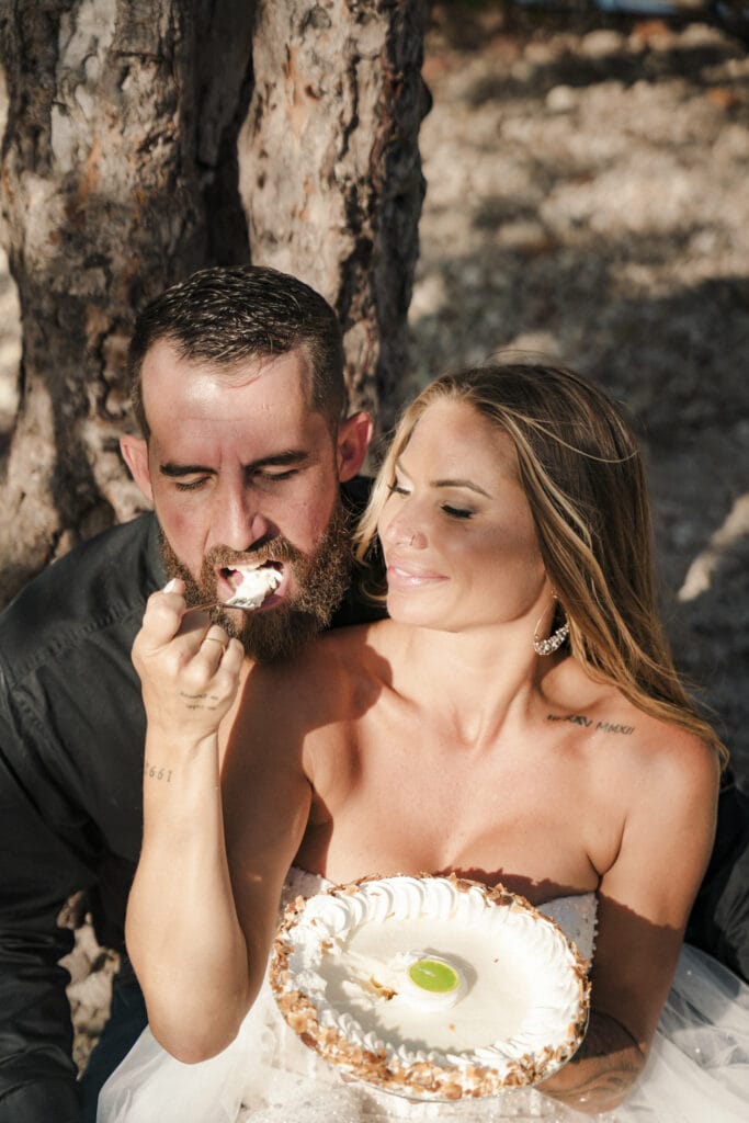 bride and groom eat key lime pie during their elopement