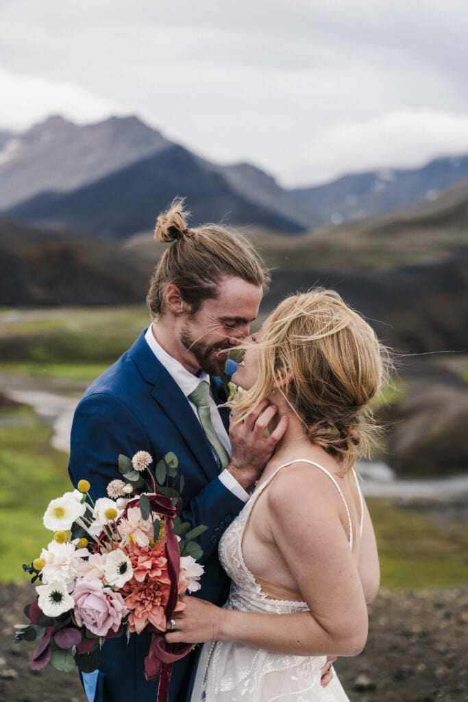 bride and groom embrace in the Iceland highlands
