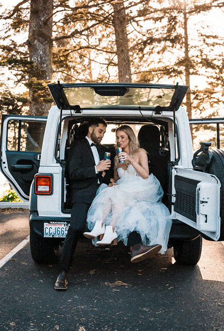 Gif of couple relaxing in the back of a Jeep