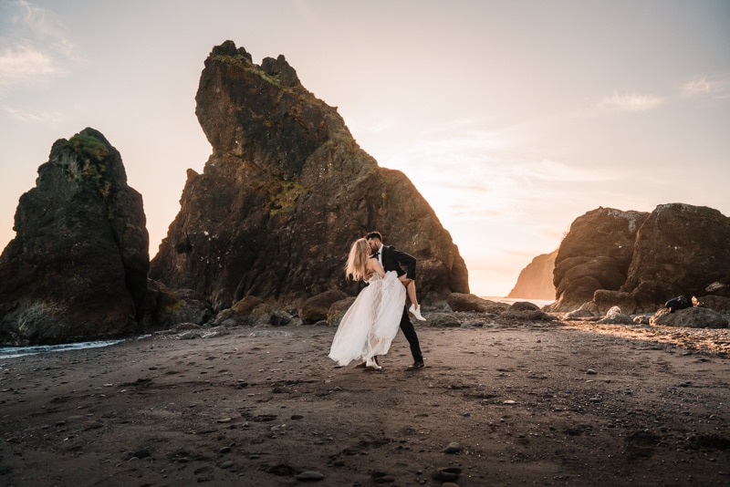 a couple kisses at their ruby beach elopement