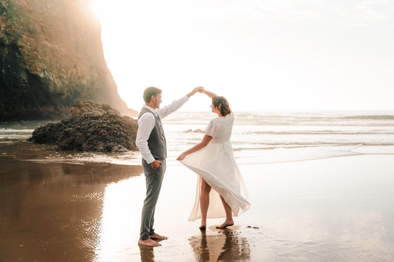 Couple dances on Cannon Beach at their elopement