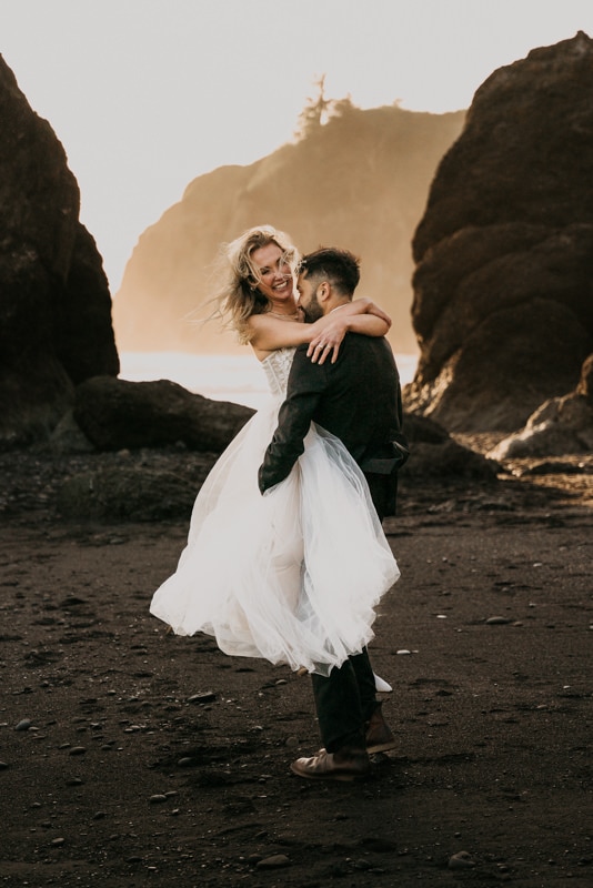 man and woman dance on Ruby Beach